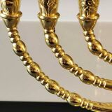 Menorah/Jewish/Hebrew candlestick with 7 arms of light. Engraved with the symbols of the 12 tribes of Israel/Holyland inscription. In gold metal. Size 20 x 16 cm