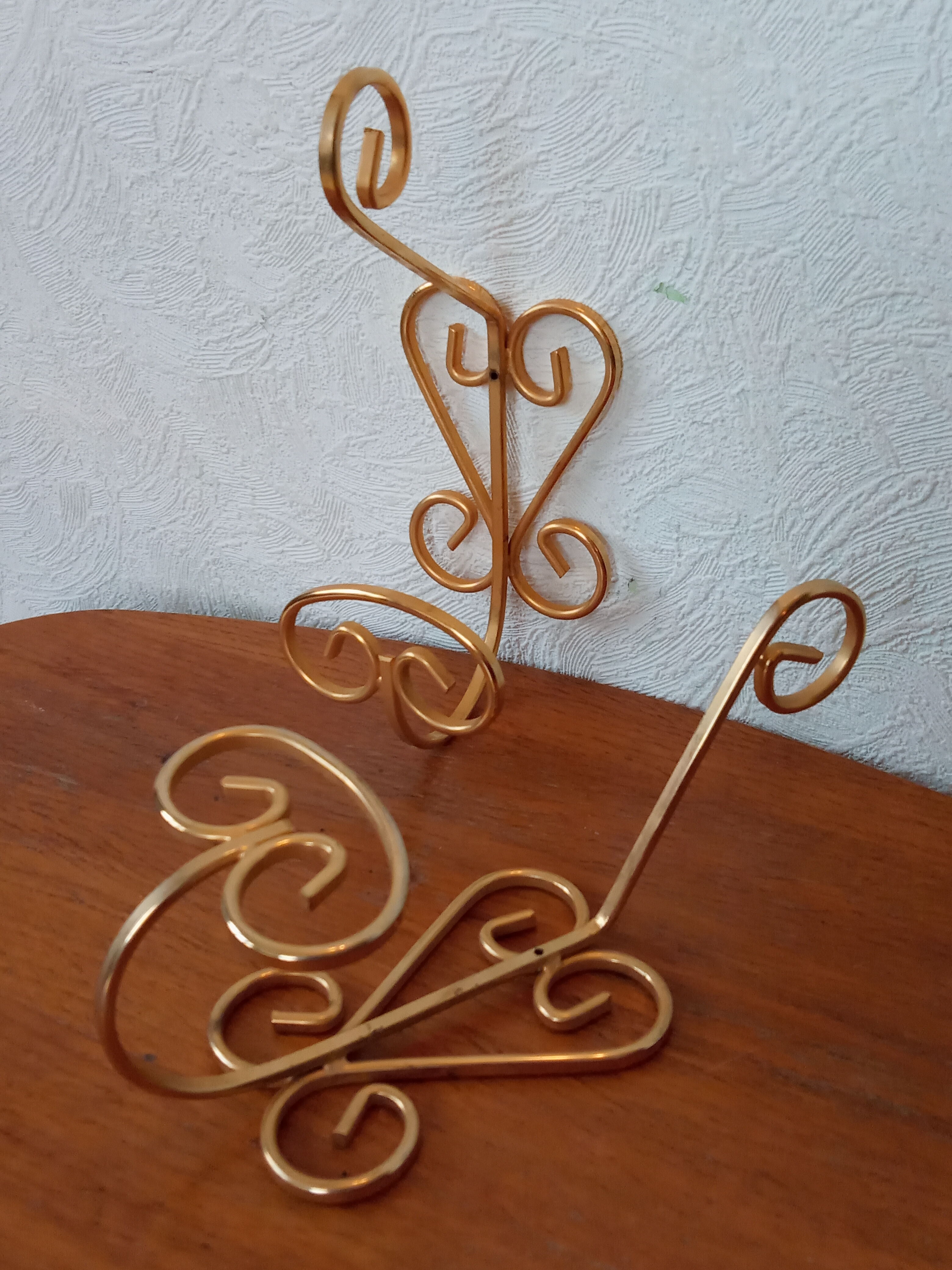 Pair of vintage gold coat hooks