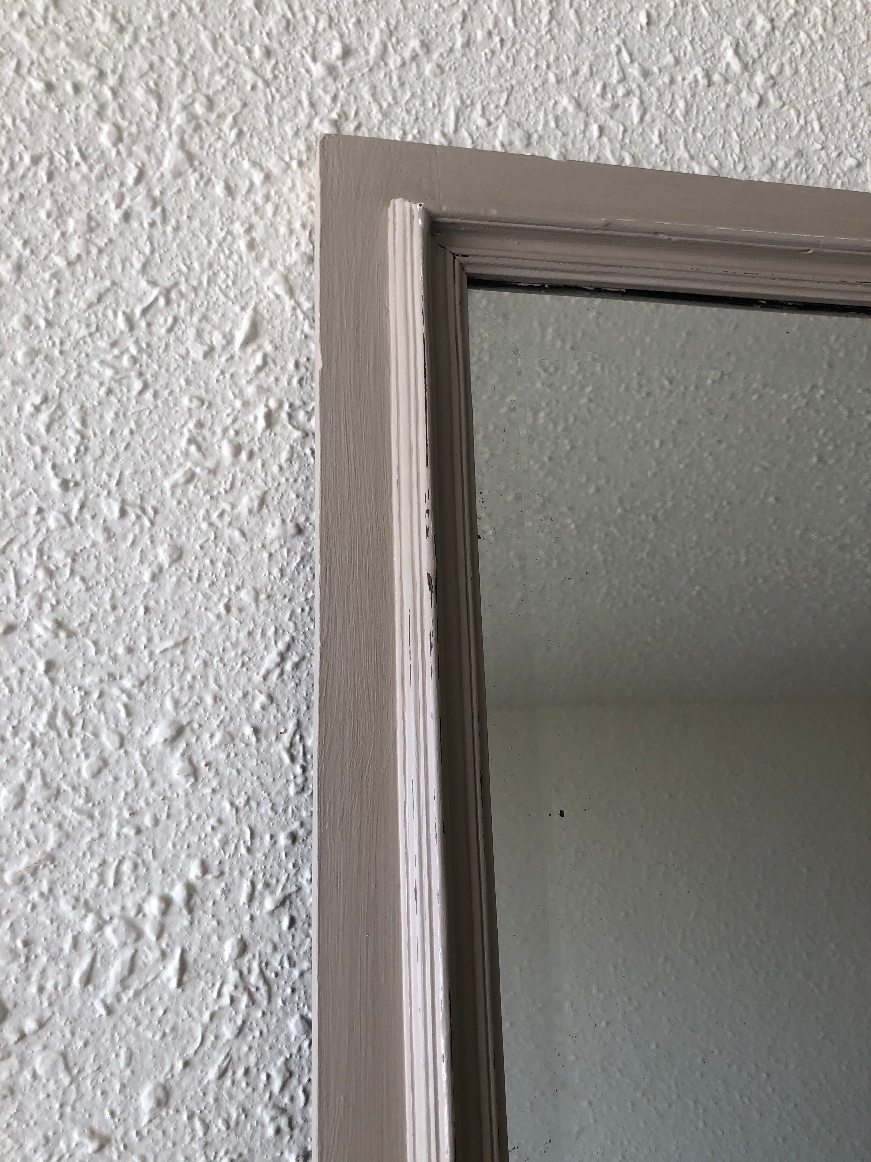 Large patinated wooden mirror with bevelled ice 73x113cm