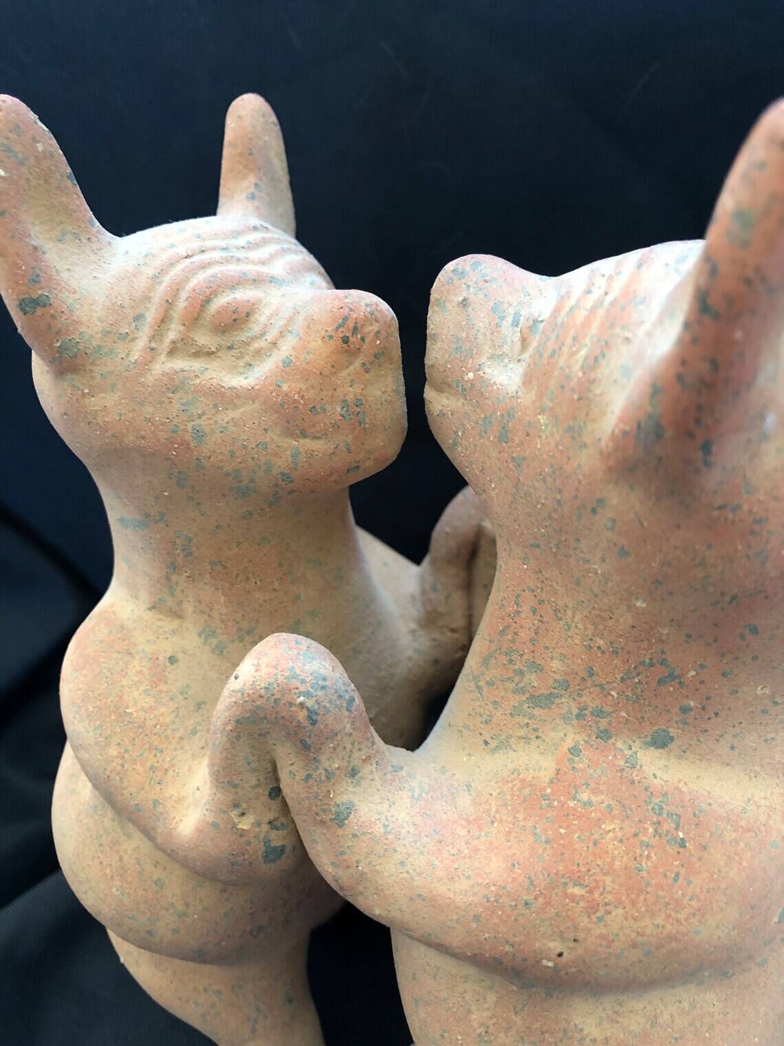 Pre-columbian style terracotta sculpture dancing fat dogs from colima mexico culture
