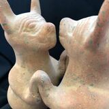 Pre-columbian style terracotta sculpture dancing fat dogs from colima mexico culture