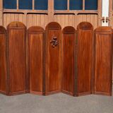 Art Deco screen with 7 panels carved with the insignia of the Foreign Legion, circa 1940