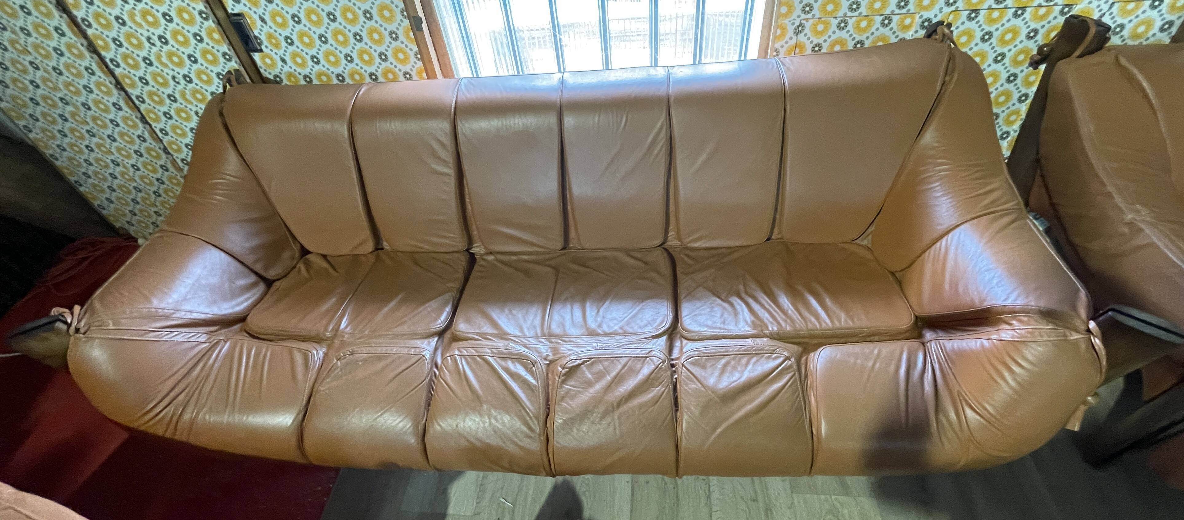 Percival lafer mp-211 sofa set with two armchairs and an ottoman in leather.