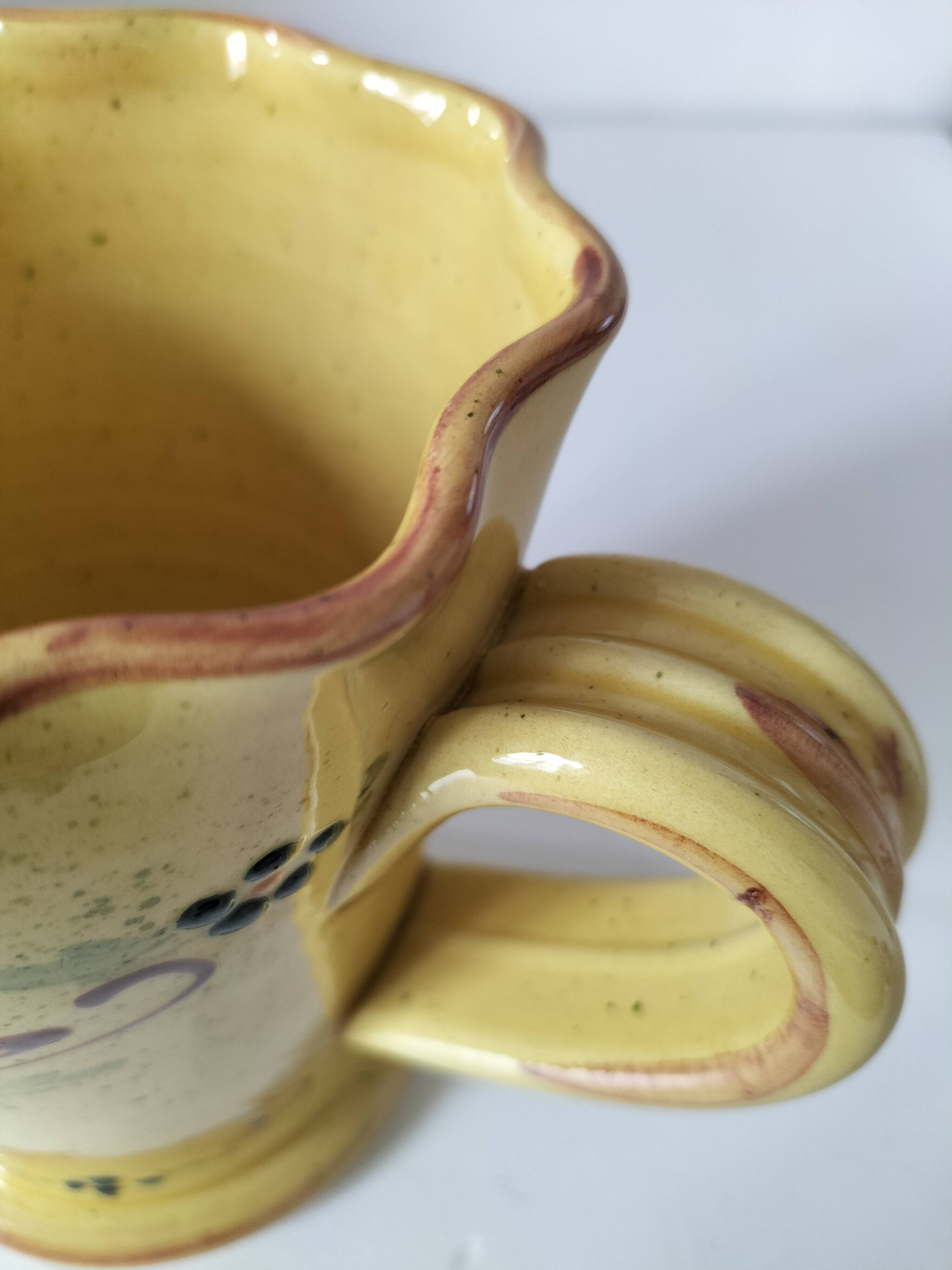 JP Daniel handmade earthenware pitcher – floral decoration on a yellow background