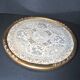 Antique lace top under glass and gilded stucco frame
