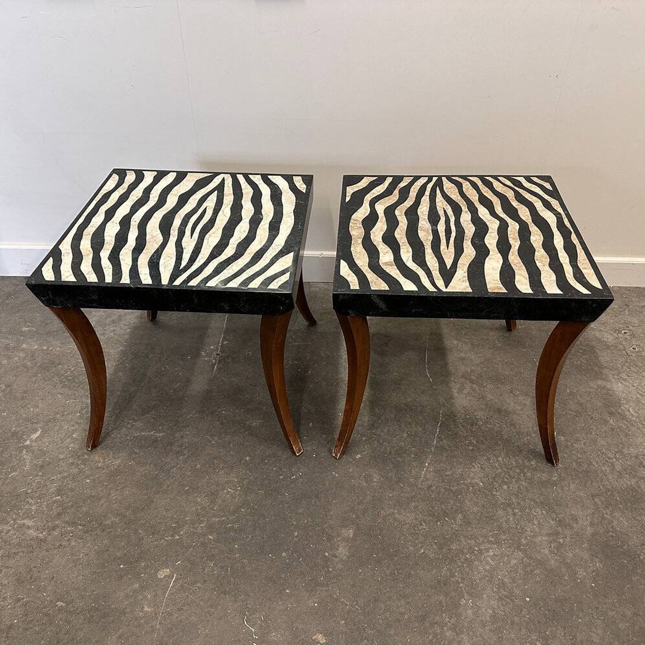 Striking pair of Italian zebra inlaid tessellated stone tables with refined curves