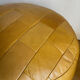 2 poufs moutarde patchwork en cuir de Sède