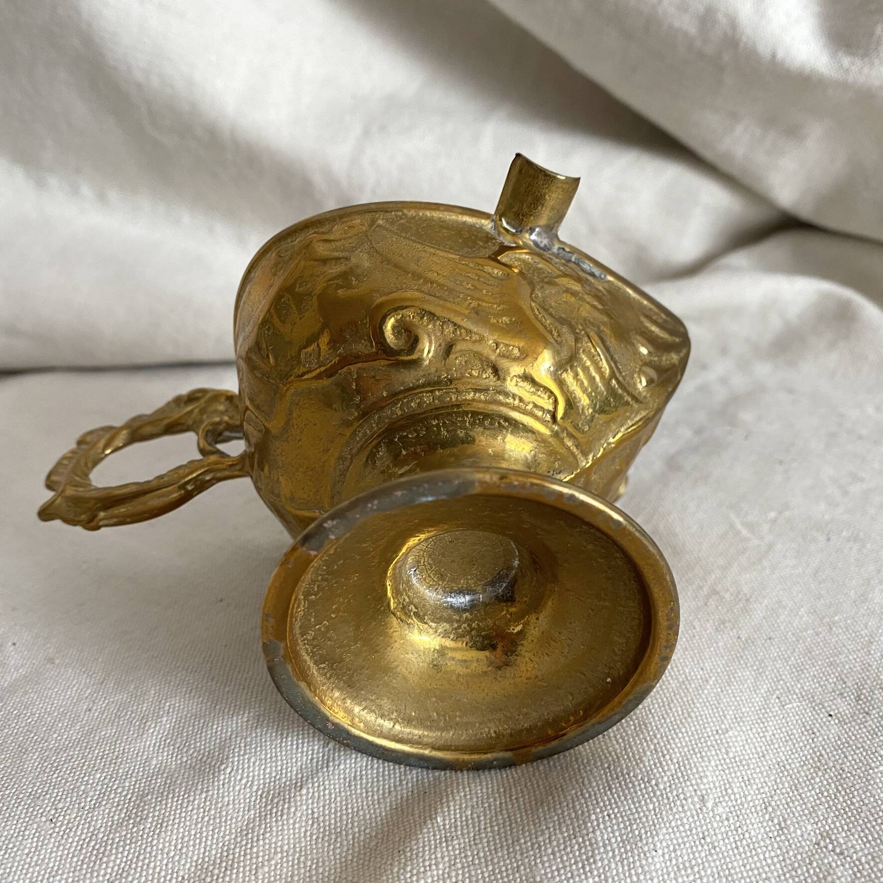 Antique embossed brass ashtray