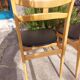 5 Scandinavian style chairs, wood and black faux leather.