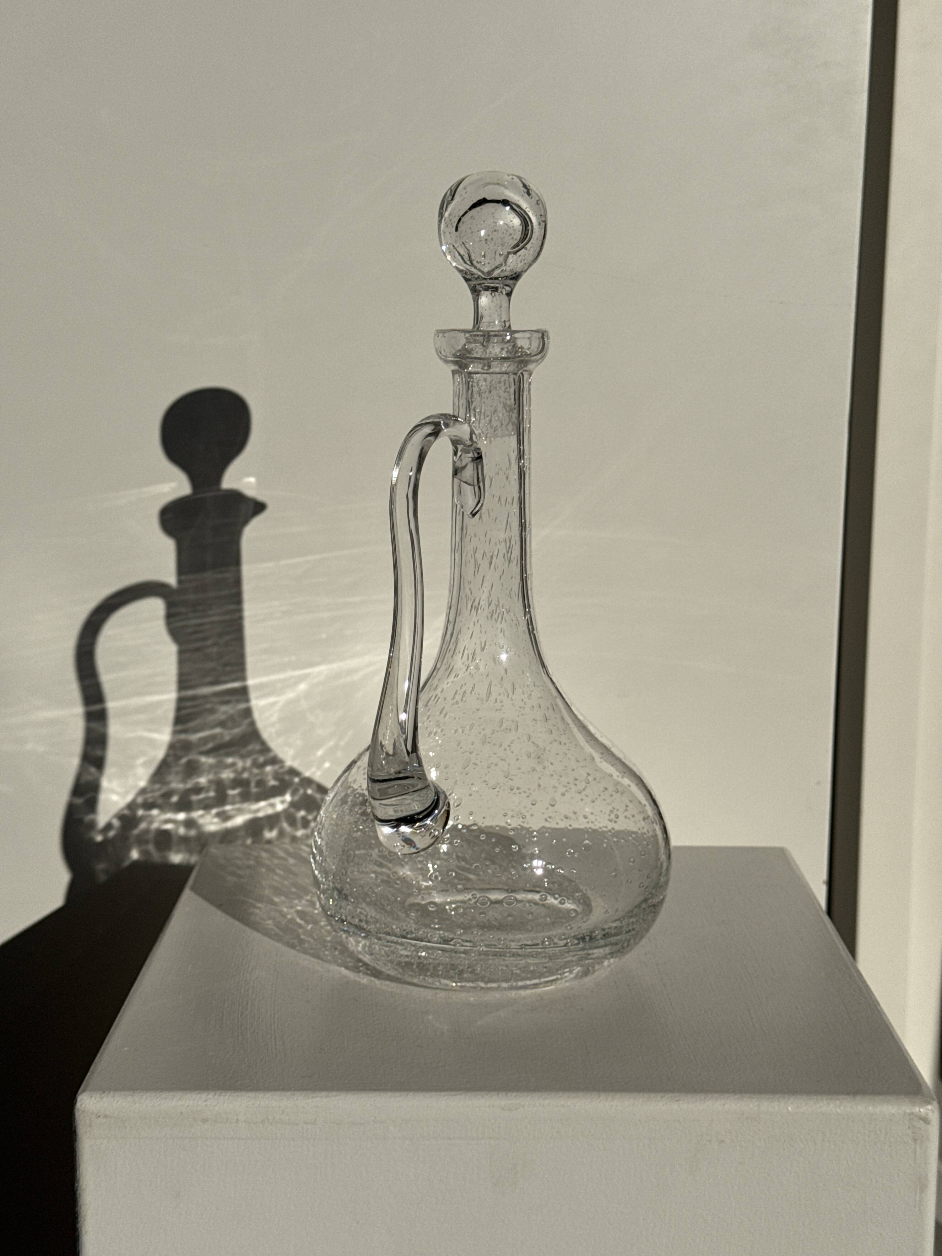 Large transparent glass carafe with a Biot stopper H32 D14.5