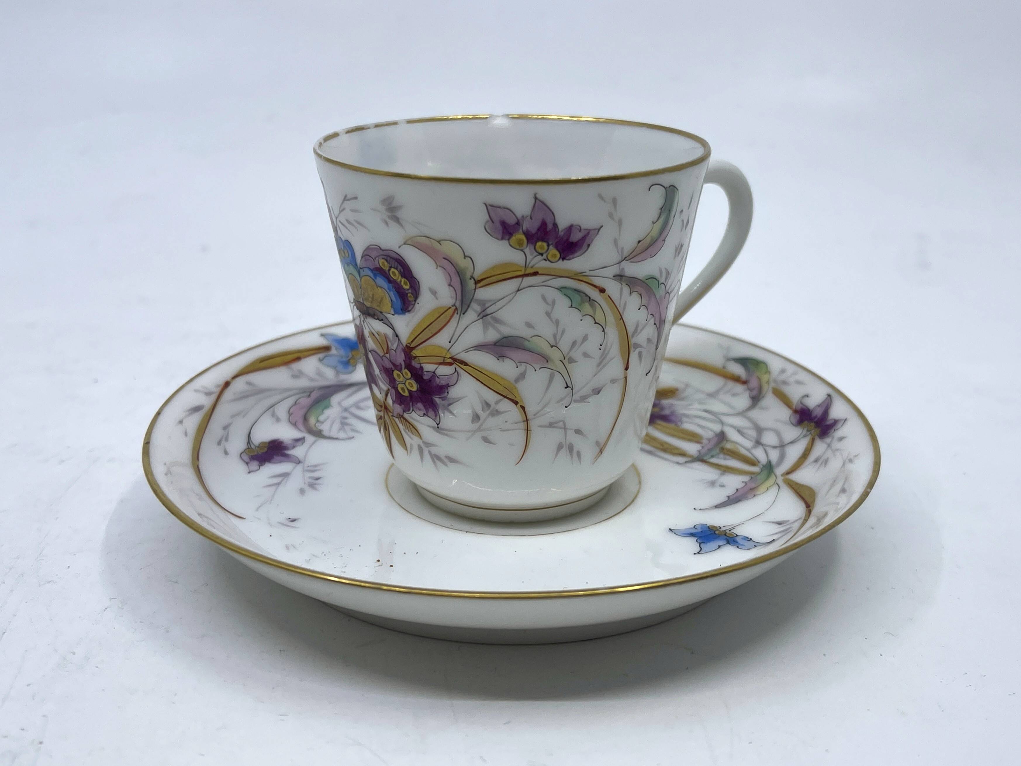 Porcelain tea service with floral and butterfly decorations, 25 pieces.