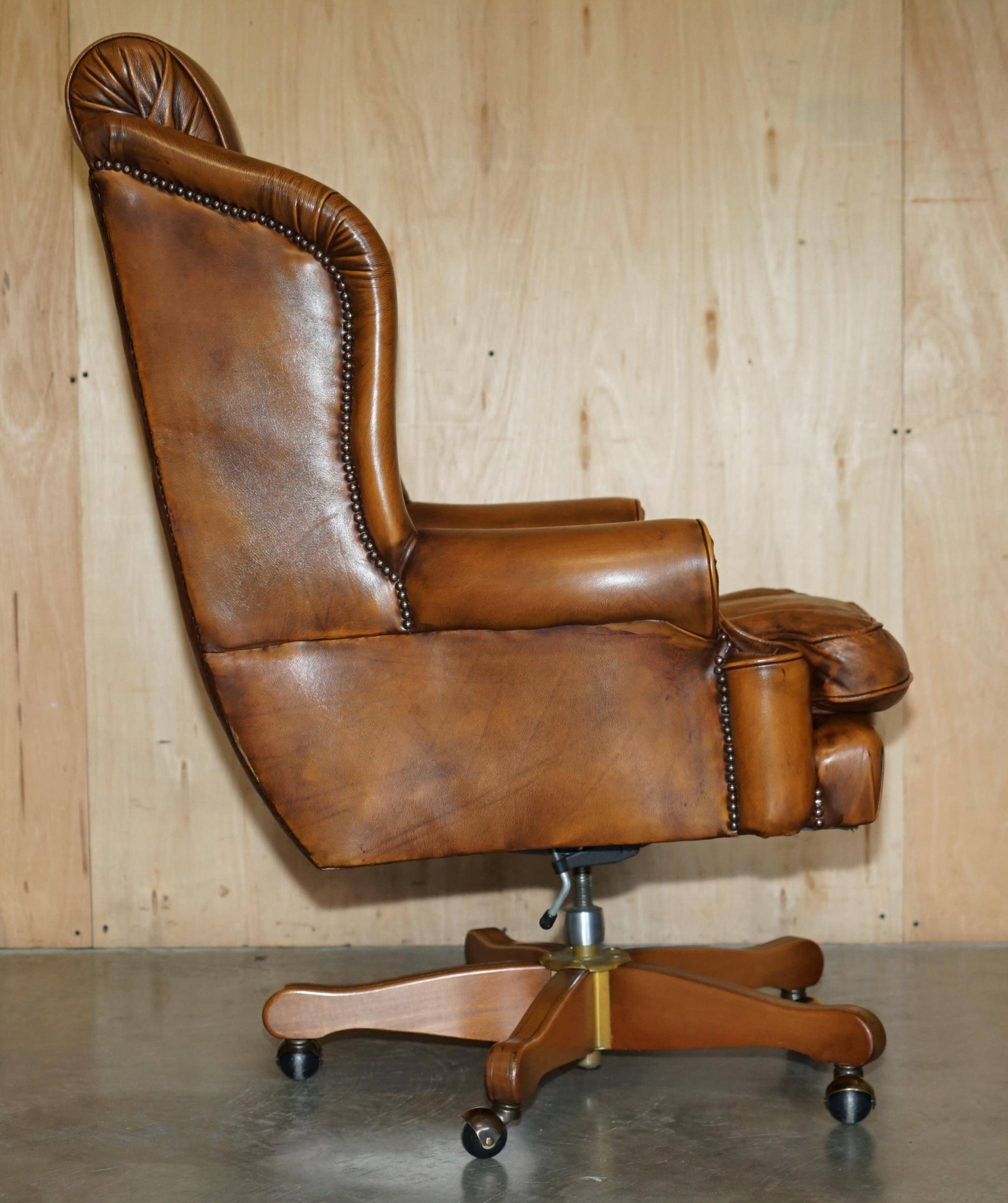 Captain's chair Chesterfield vintage leather with tufted wingback.