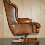 Captain's chair Chesterfield vintage leather with tufted wingback.