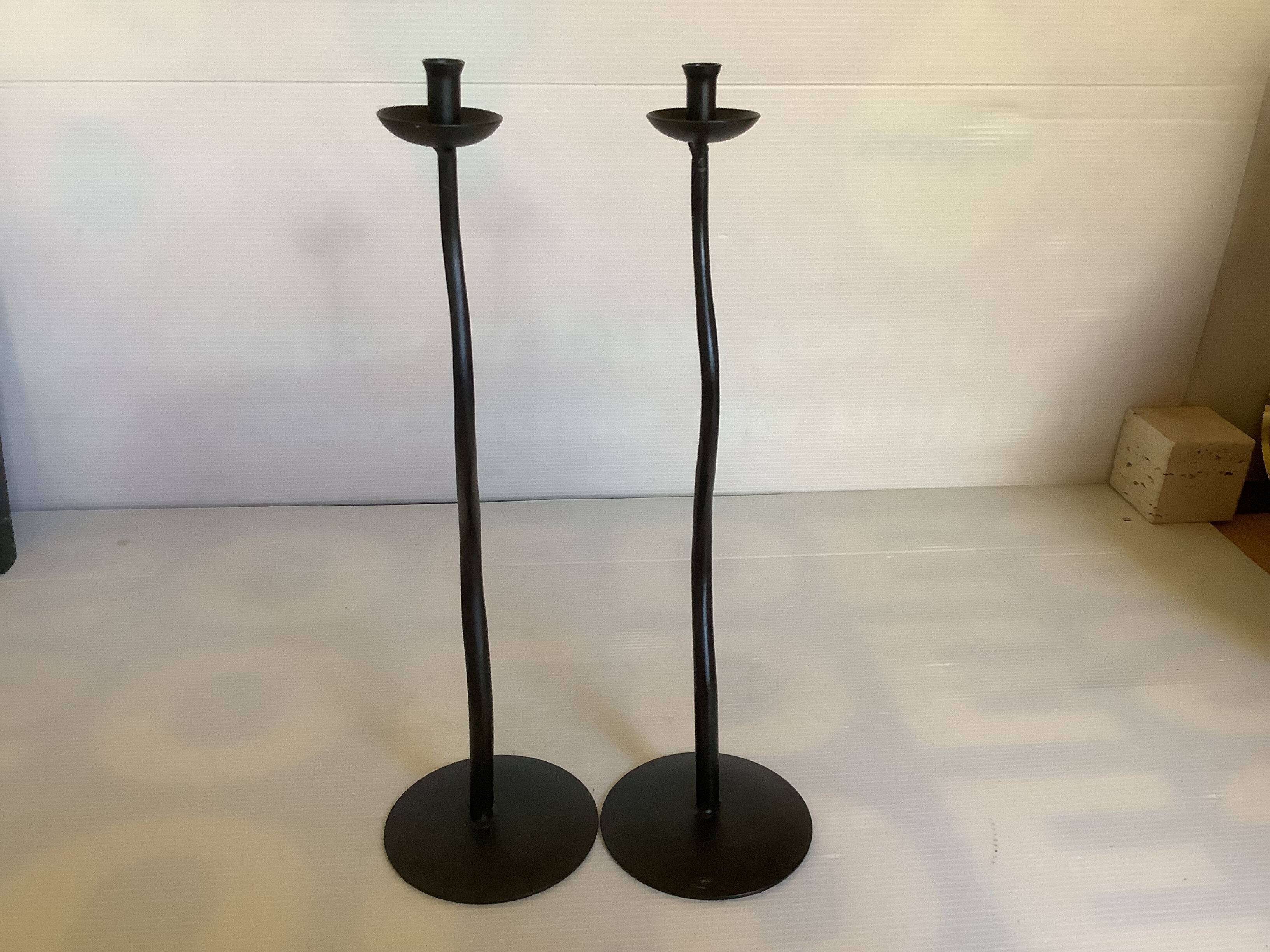 Pair of black hysteria-style candlesticks