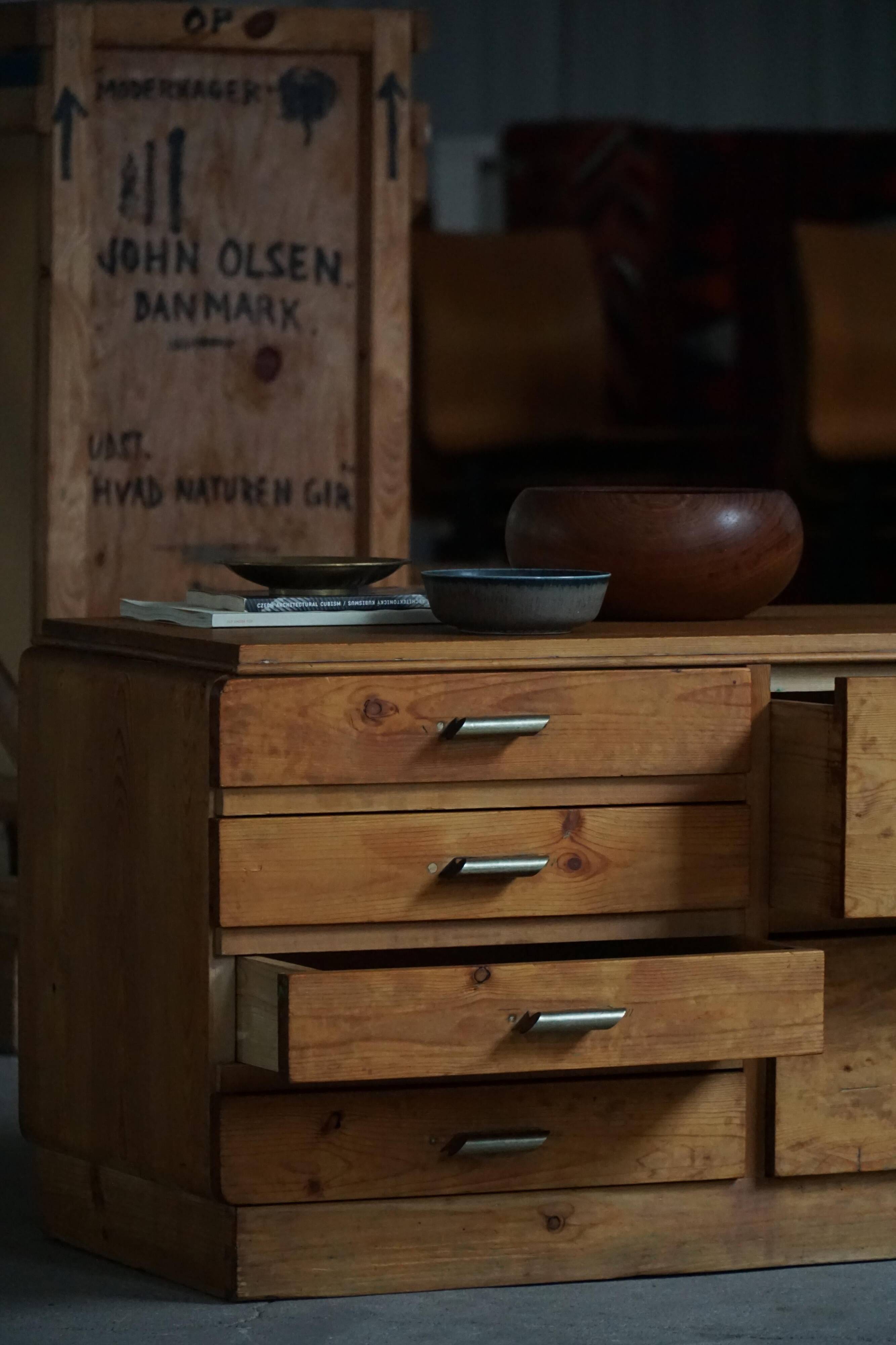 Mid-20th century Art Deco chest of drawers in pine with metal handles, 1940s.