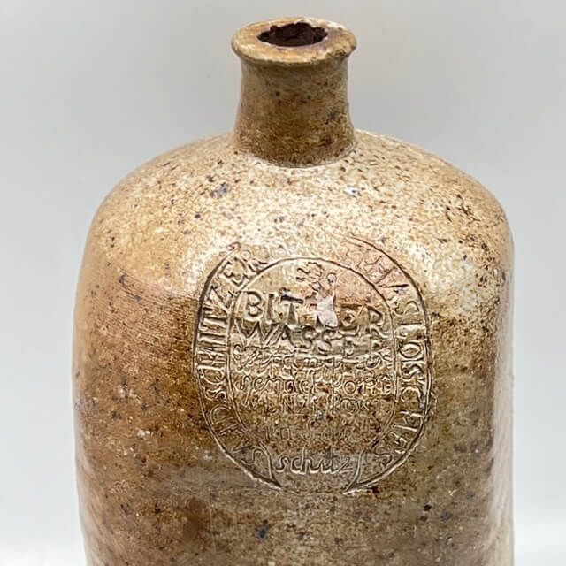 Engraved and square stoneware bottle
