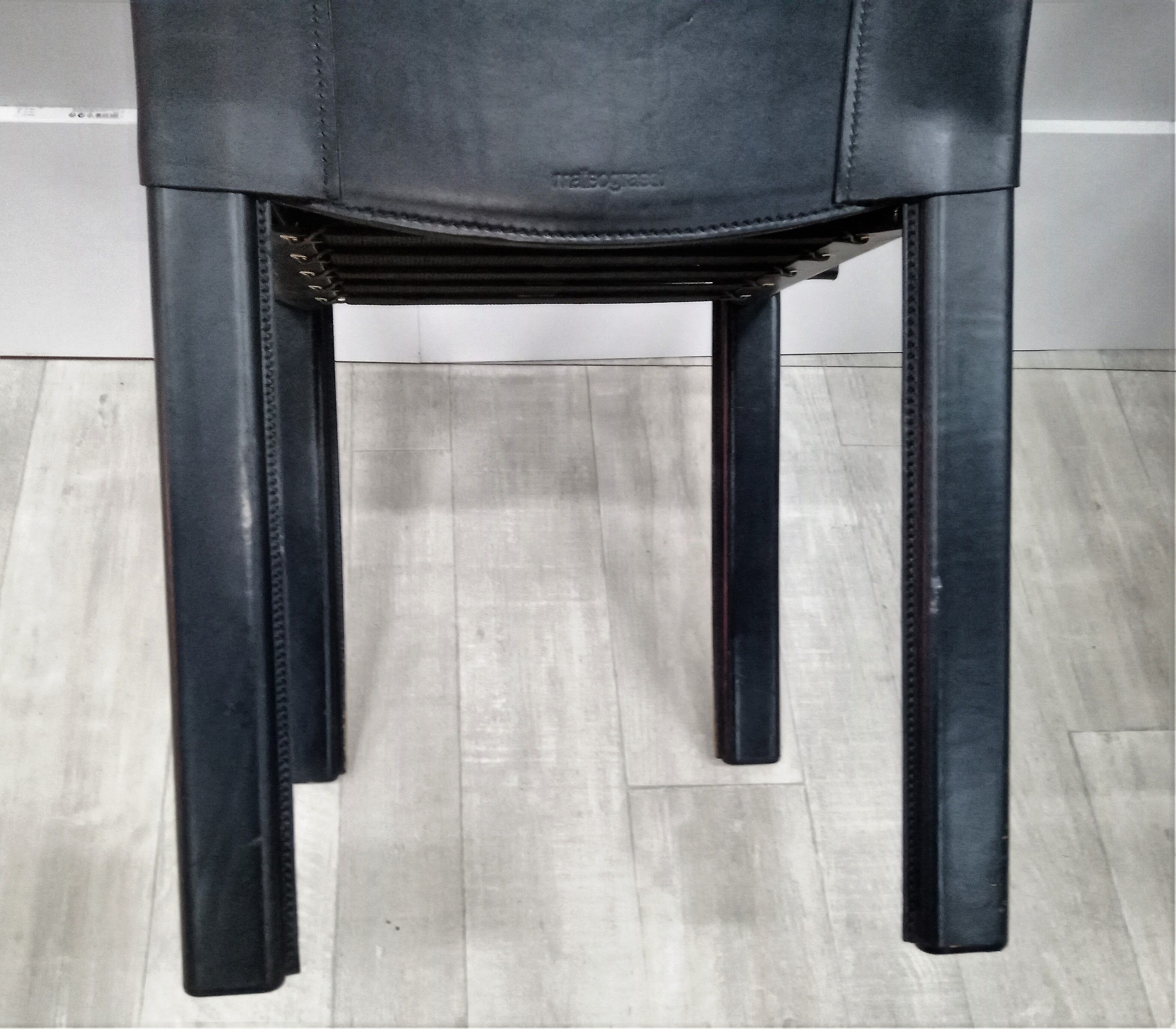 Black leather coral chairs by Matteo Grassi