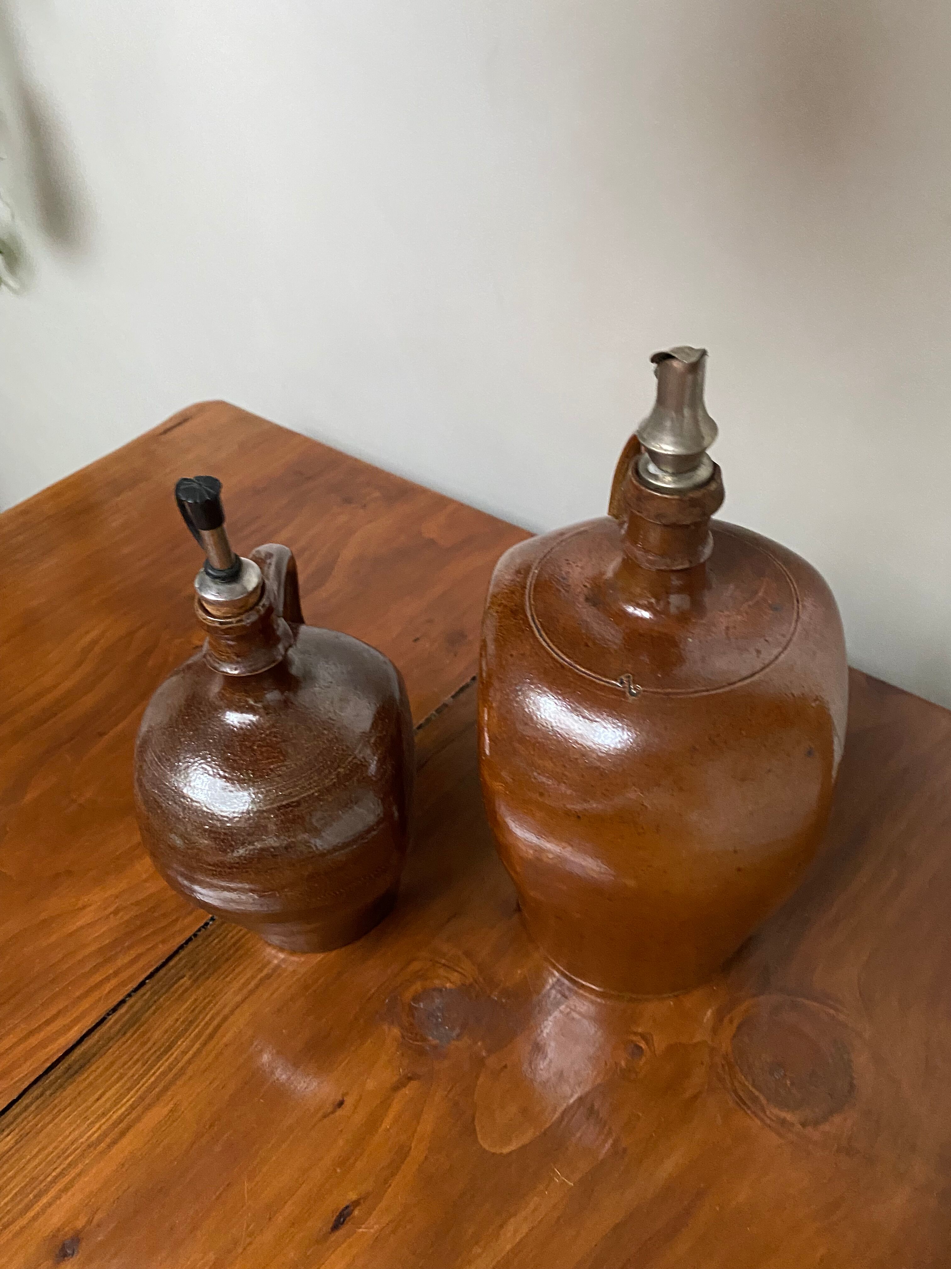 Pair of bottles in sandstone