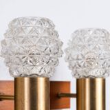 Pair of Swedish wall lamps with teak wood, brass and glass cup shade