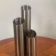 Vintage trio of brushed stainless steel candle holders