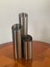 Vintage trio of brushed stainless steel candle holders