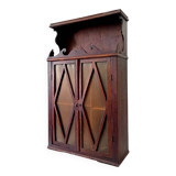 Small antique wall cabinet in Gothic style.
