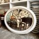 Oval mirror in pearl-coloured stucco 85 x 114 cm