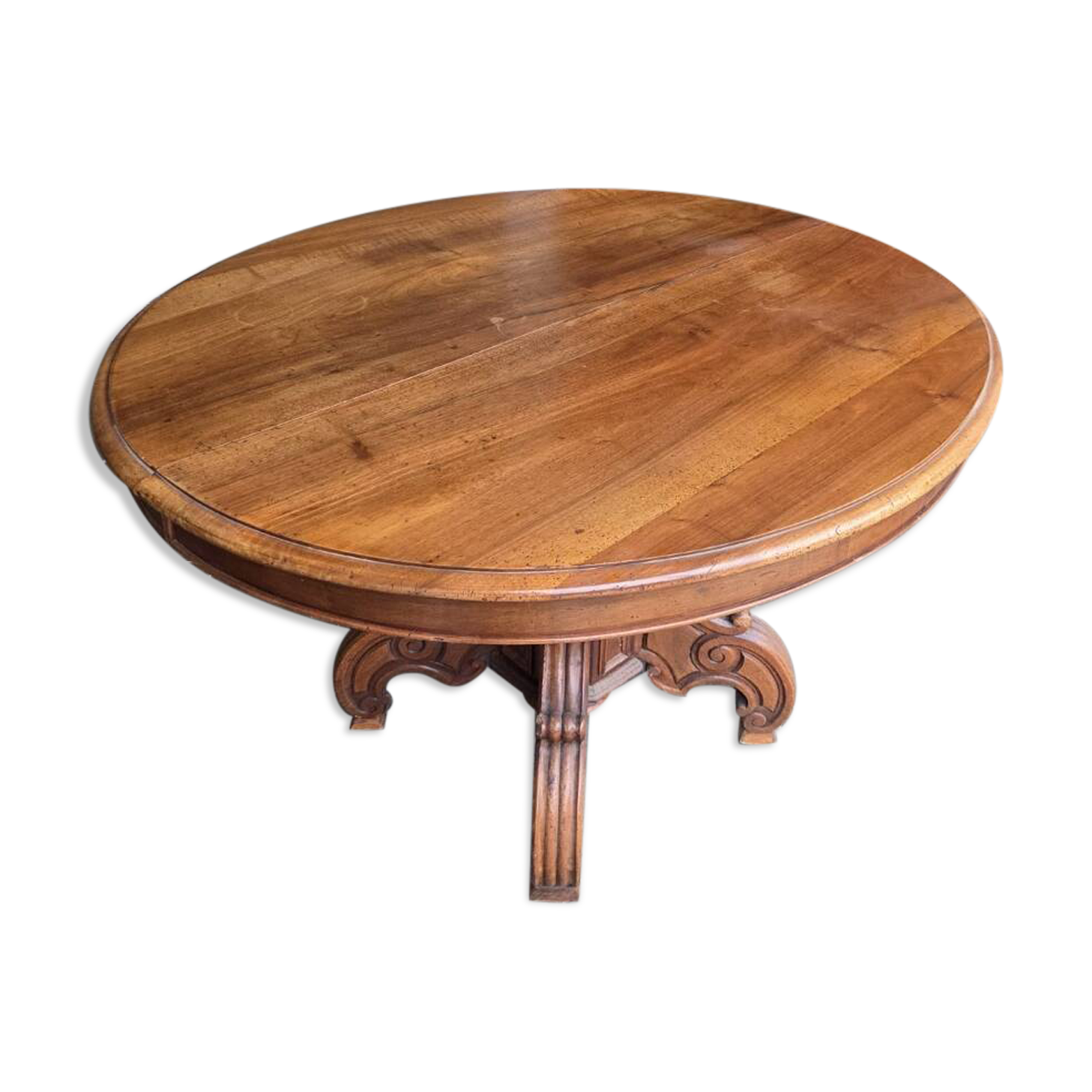 Extendable walnut table in the Napoleon III style.