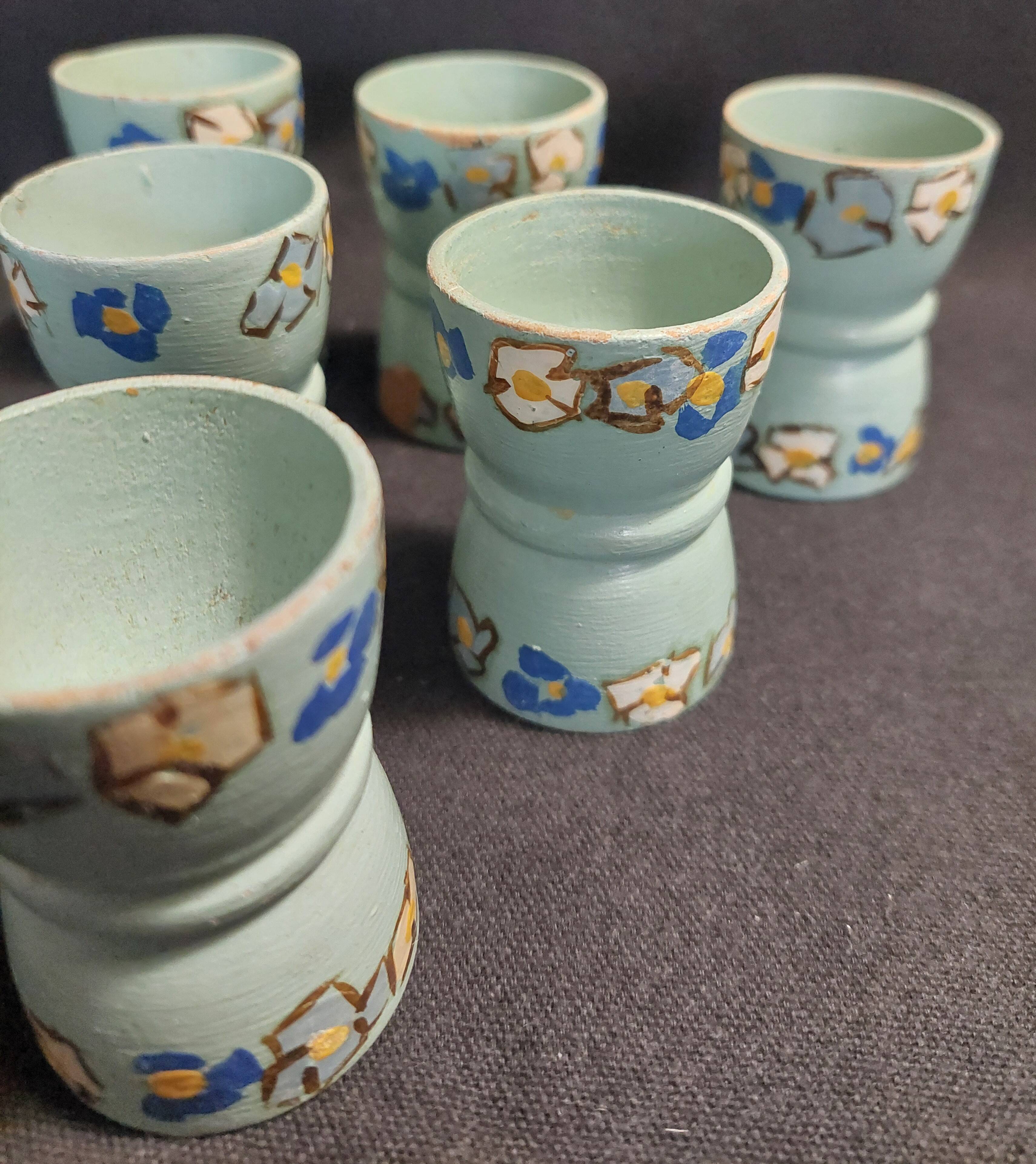 Antique painted wooden egg cups, set of six from the 1930s.