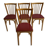 Set of 4 Baumann bistro chairs with dark red faux leather cushions.