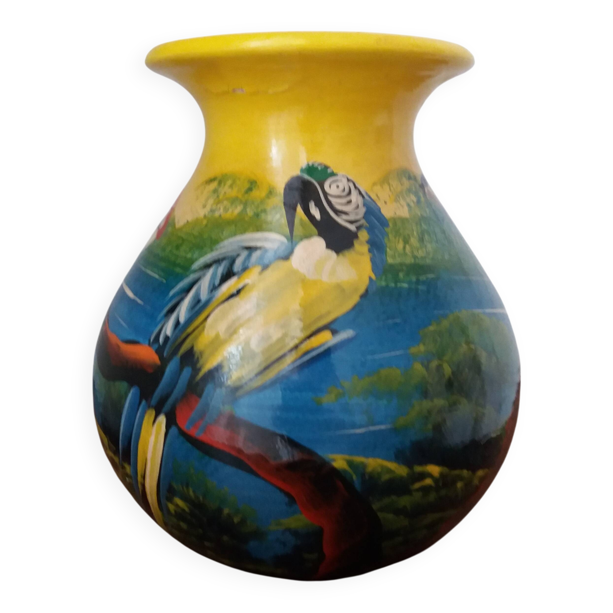 Mexican popular art vase decorated with parrots and toucans.