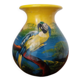 Mexican popular art vase decorated with parrots and toucans.