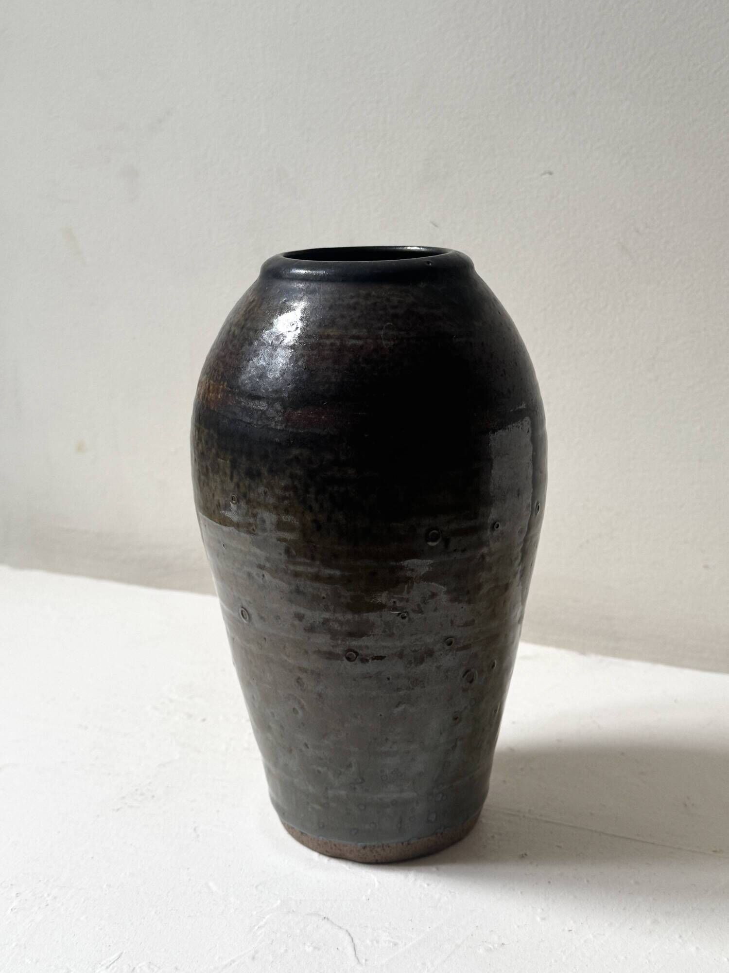 Brown-black glazed stoneware vase, signed underneath the base, circa 1950.