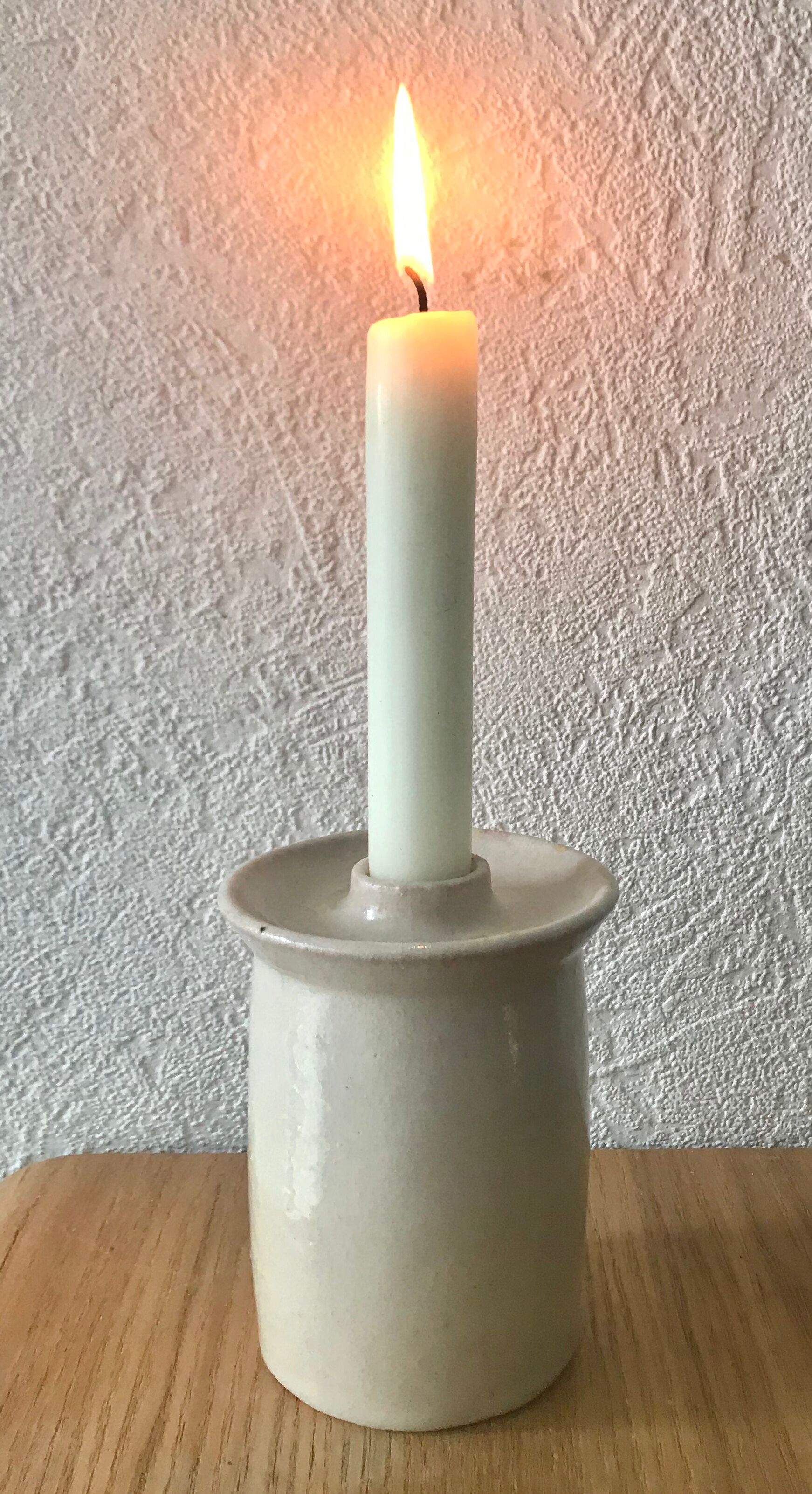 White enamelled sandstone candlestick