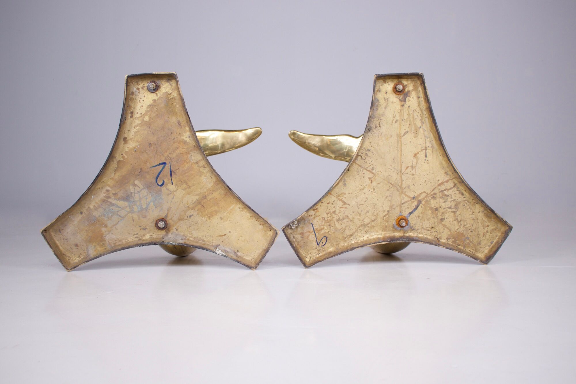 Solid brass dolphin console feet.