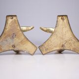 Solid brass dolphin console feet.