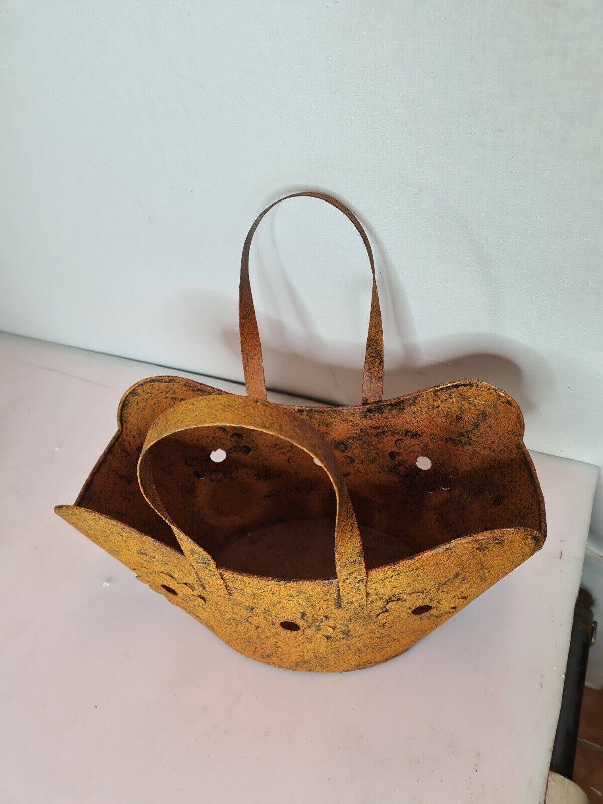 basket-shaped planter in patinated iron