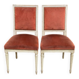 2 Louis XVI chairs in solid wood and orange velvet.