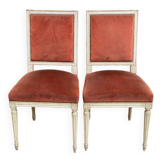 2 Louis XVI chairs in solid wood and orange velvet.