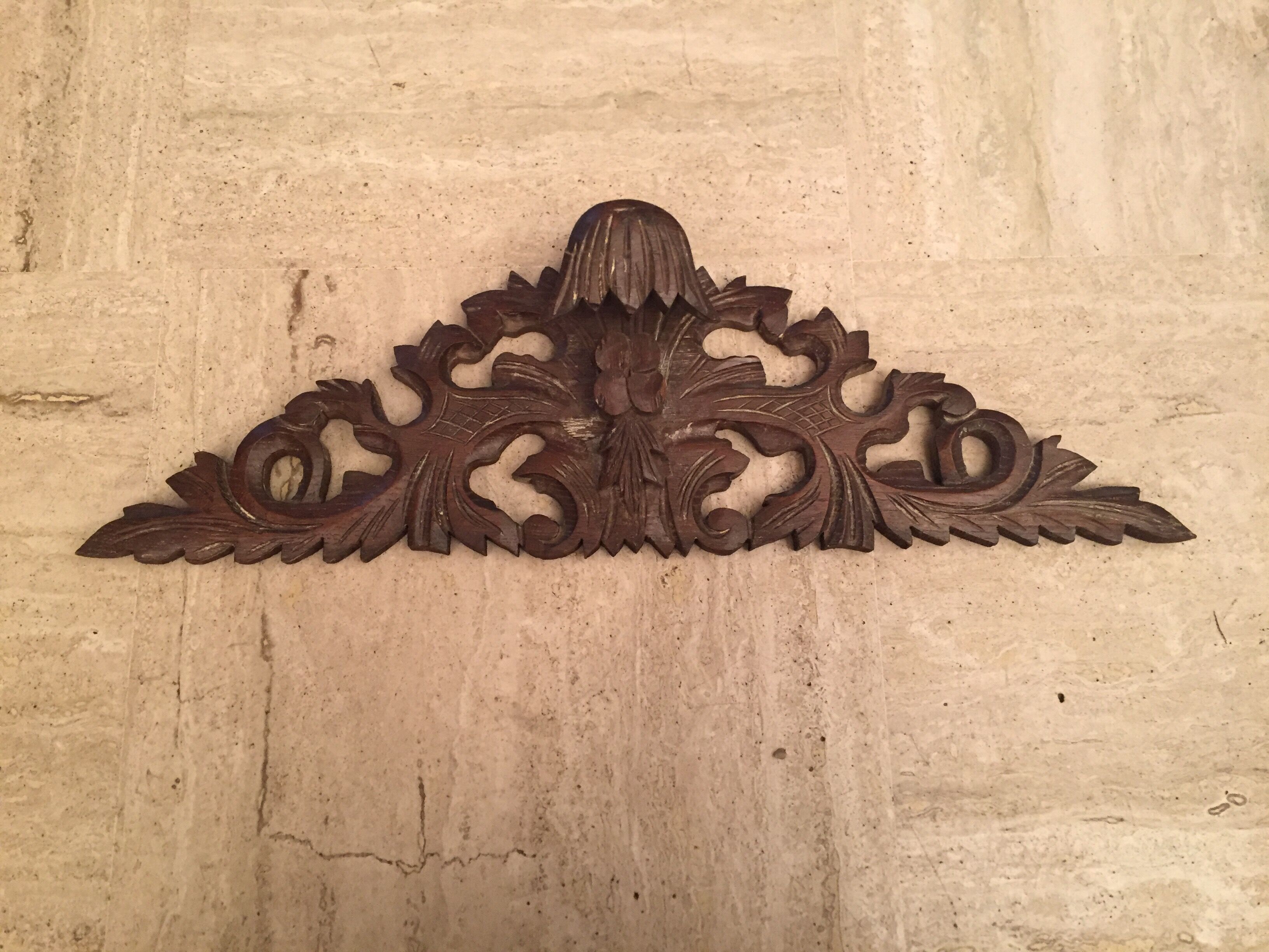 Former finely carved wooden pediment