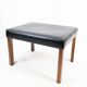 Tabouret en cuir noir et pieds en palissandre, design danois des années 1960