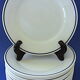 Suite of twelve (12) hotel-grade porcelain table plates