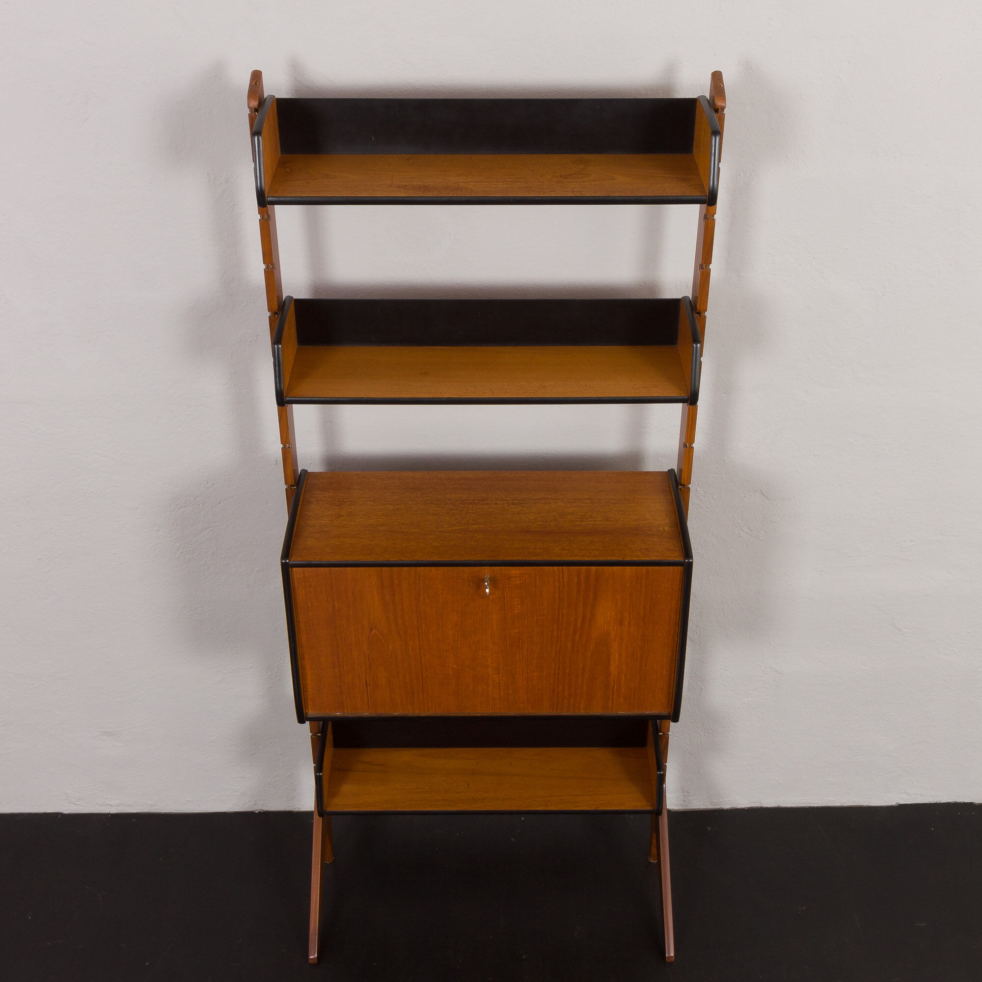 Scandinavian free standing vertical bookcase with a secrtetaire or home office wall unit model Ergo,