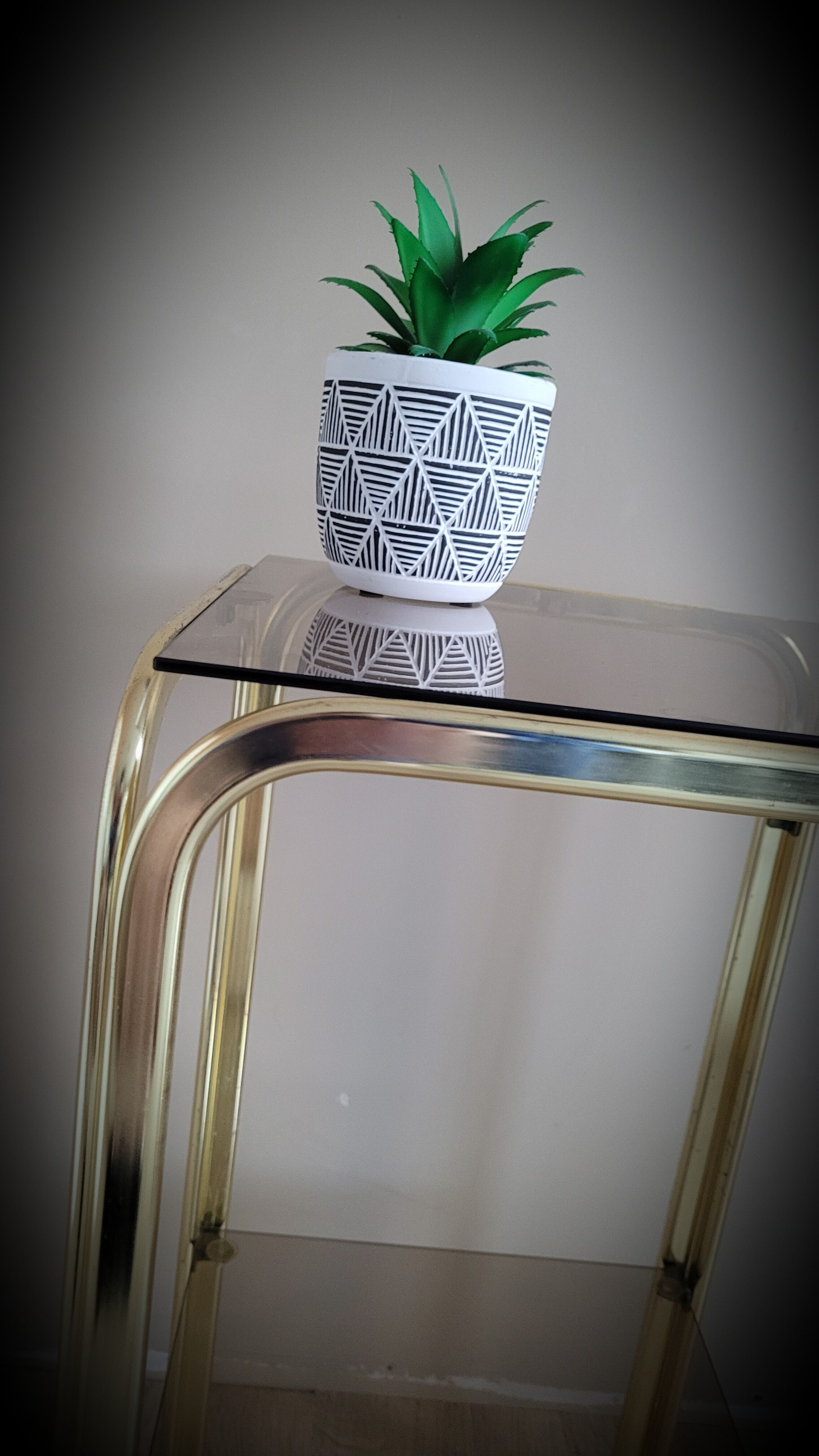 Golden side table and smoked glass