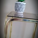 Golden side table and smoked glass