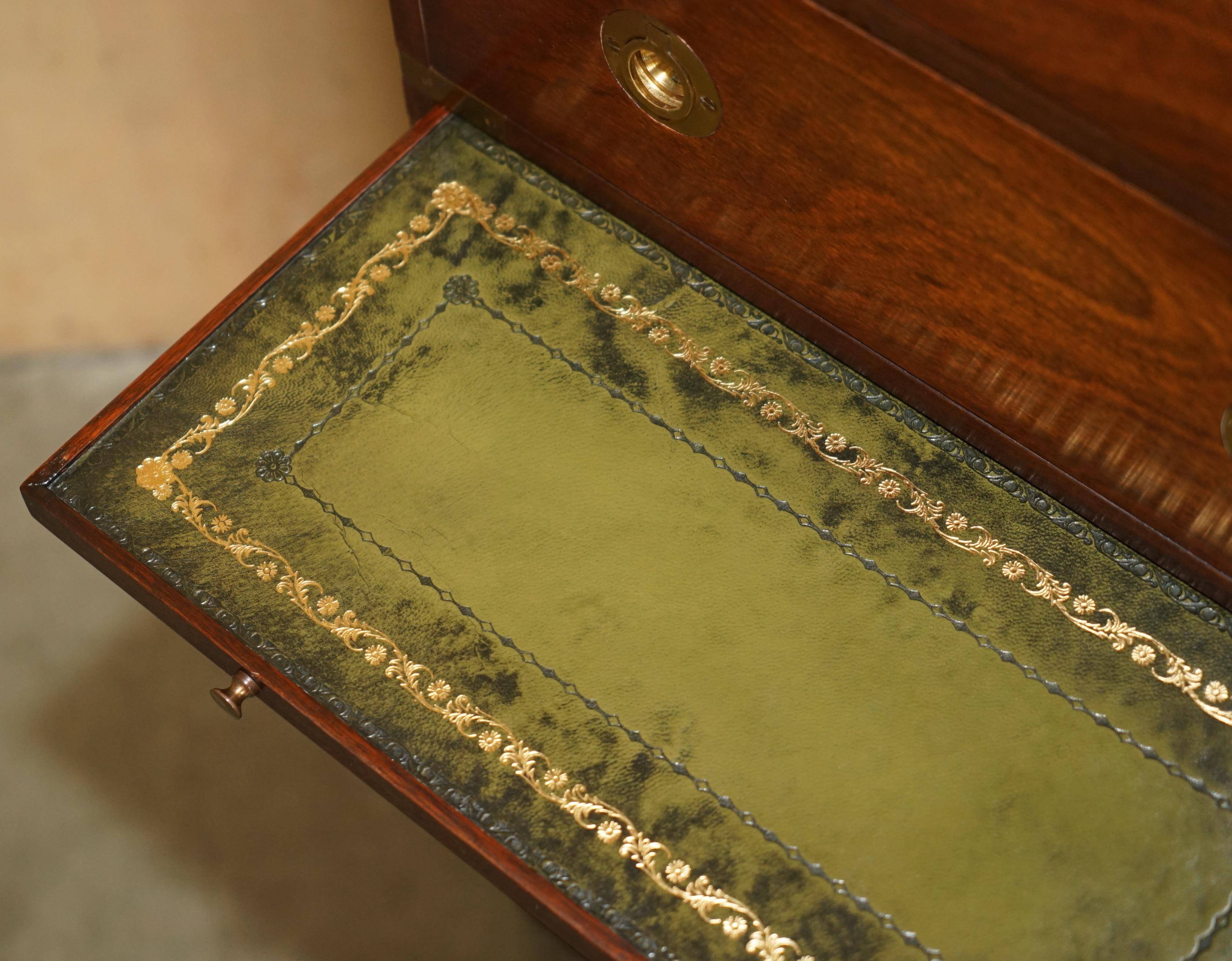 Pair of vintage military campaign high chests of drawers with leather tops.