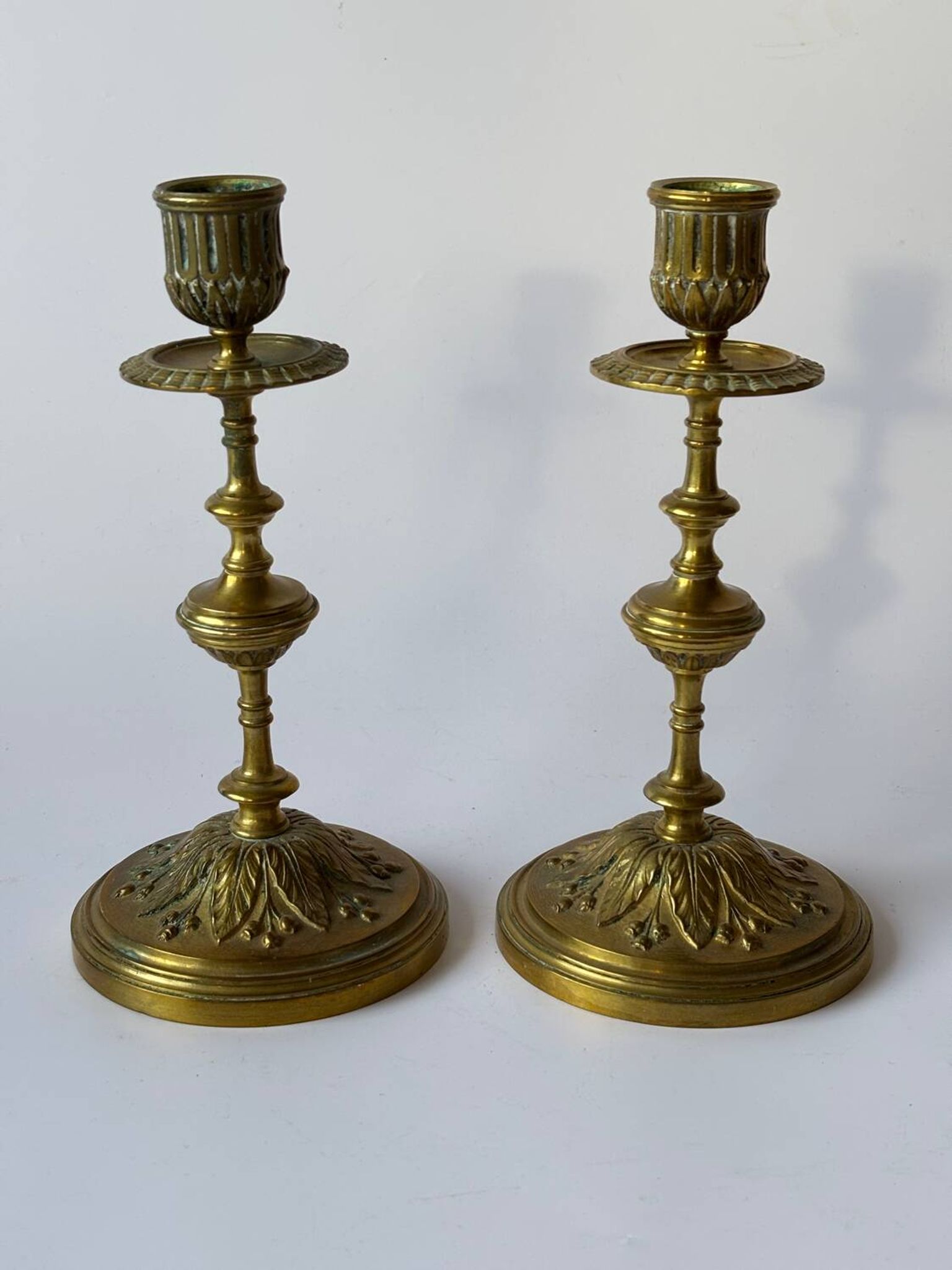 Pair of neoclassical brass candlesticks