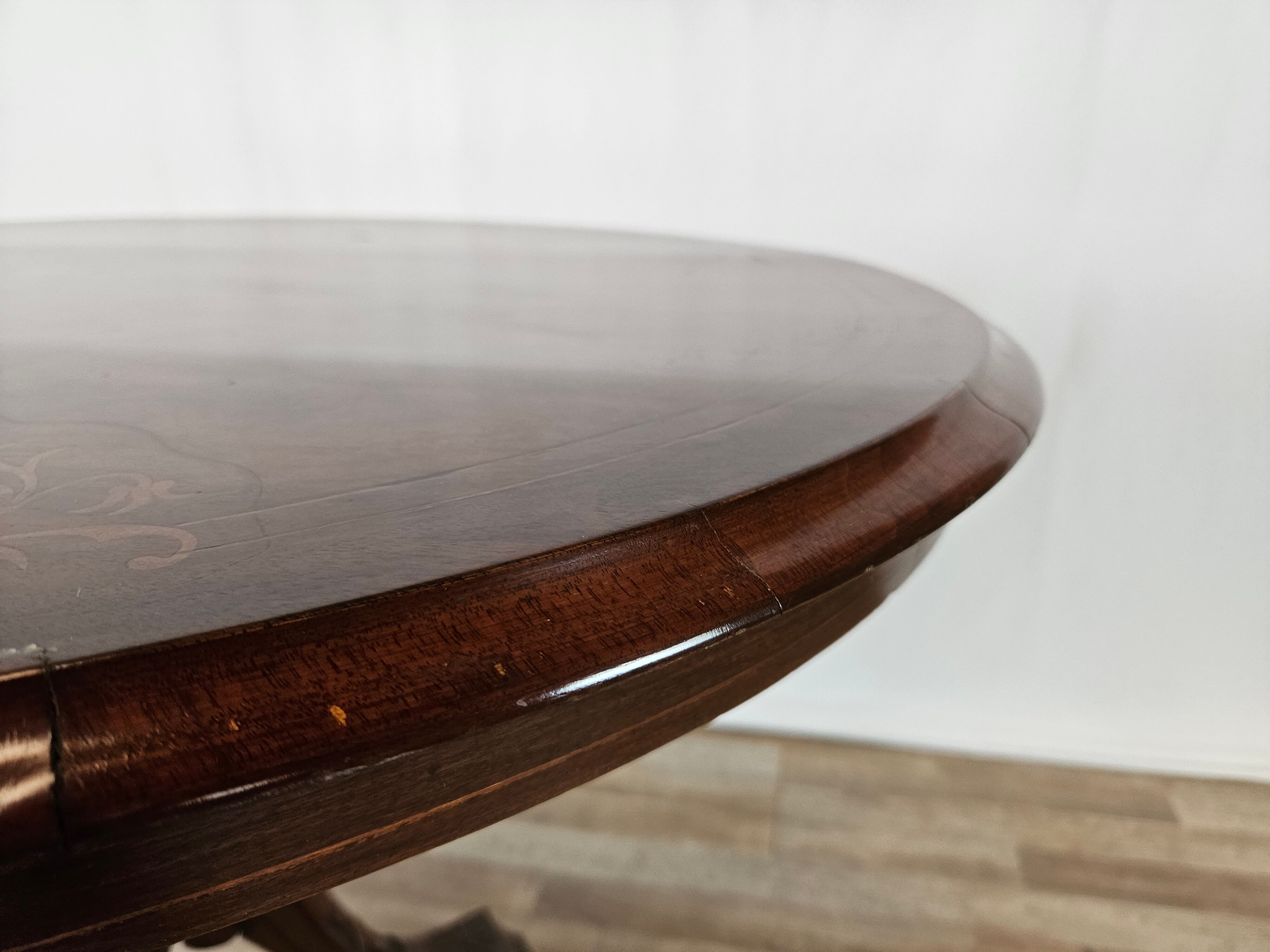 Coffee table in walnut with maple inlays and wheels