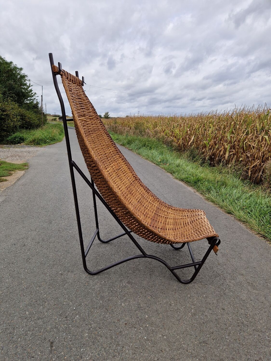 Large vintage metal and wicker armchair