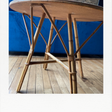 Round coffee table, in rattan and wood